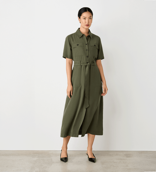 Full body view of a model wearing the Cassidy Khaki Midi Shirt Dress facing forward.