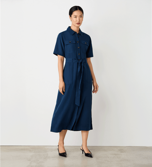 Full body view of a model wearing the Cassidy Navy Midi Shirt Dress facing forward.