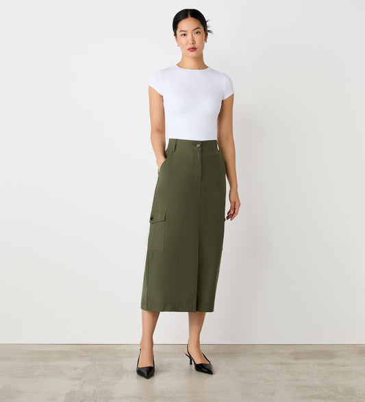 Full body view of a model facing forward wearing the Juliette Khaki Cargo Skirt paired with a white tee.