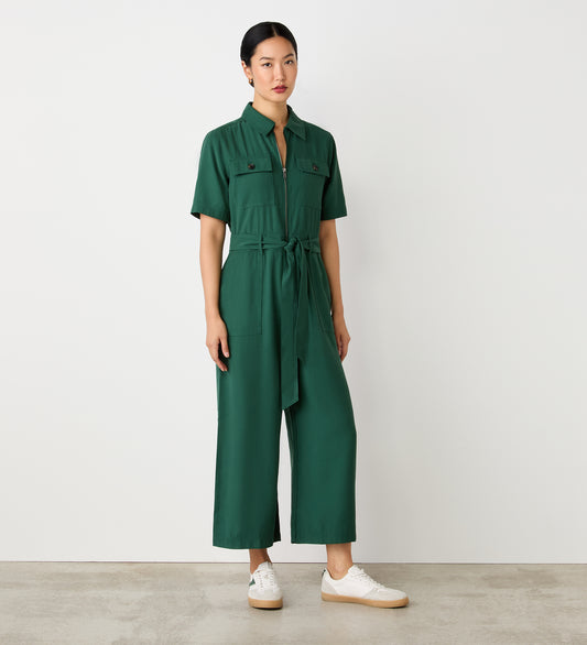 Full body view of a model wearing the Marie Dark Green Utility Jumpsuit facing forward.